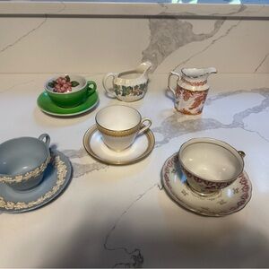 Several collectible tea sets from Greenbrier to Wedgewood Cup and Saucer.